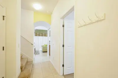 a hallway with a white door leading to a room at Encantada -4 Bedroom Townhome W- Splashpool-2651En in Kissimmee