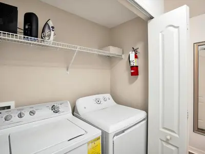 a small laundry room with a washer and dryer at Close To Clubhouse, Splashpool-3026Pp in Kissimmee