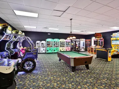 a gaming room with a pool table and arcade machines at Close To Clubhouse, Splashpool-3026Pp in Kissimmee