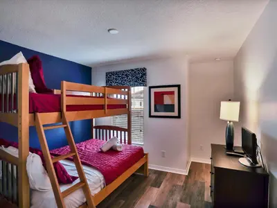 a bedroom with a bunk bed and a desk at Close To Clubhouse, Splashpool-3026Pp in Kissimmee