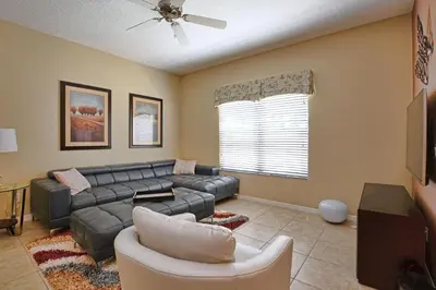 a living room with a couch and a tv at Close To Clubhouse, Bbq, Wifi-3001Ppr in Kissimmee