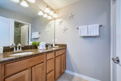 a bathroom with a sink and a mirror at Bright & Cheery Decor, Townhome Wspashpool-3015Pp in Kissimmee