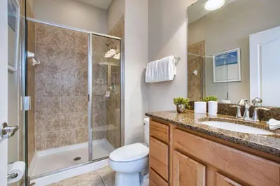 a bathroom with a shower and a toilet and a sink at Bright & Cheery Decor, Townhome Wspashpool-3015Pp in Kissimmee