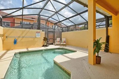 a swimming pool in a building with a glass roof at Bright & Cheery Decor, Townhome Wspashpool-3015Pp in Kissimmee