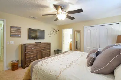 a bedroom with a bed and a ceiling fan at Paradise Palms-4 Bed Townhouse Wsplashpool3622Ppr in Kissimmee