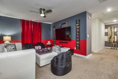 a living room with a white couch and a tv at Across From Clubhouse, Private PoolSpa-1651Str in Kissimmee