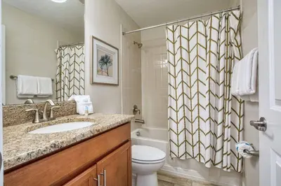 a bathroom with a sink and a toilet and a shower at Across From Clubhouse, Private PoolSpa-1651Str in Kissimmee
