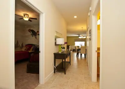 a hallway with a living room and a dining room at Beautiful Waterfront Townhome Wsplashpool-3024 in Kissimmee