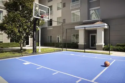 a basketball court in front of a building at Homewood Suites by Hilton Orlando Airport in Orlando