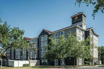 a rendering of the front of a hotel at La Quinta by Wyndham Orlando Lake Mary in Lake Mary