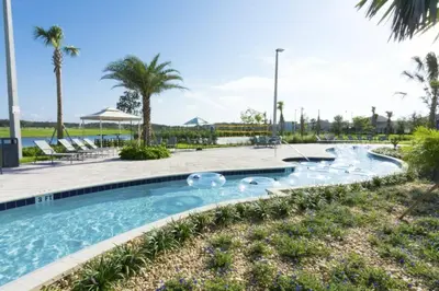 a swimming pool at a resort with palm trees at Perfect Townhome for your Vacation with Private Pool SL4807 in Kissimmee