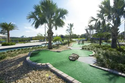 a miniature golf course at a resort with palm trees at Perfect Townhome for your Vacation with Private Pool SL4807 in Kissimmee