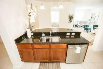 a kitchen with a sink and a counter at Modern Vacation Apartment with a Lake View in Orlando