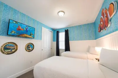 a bedroom with two beds and blue walls at Gorgeous Home With Private Pool, Themed Rooms Near Disney With Waterpark & Resort Access At Encore Resort - 7687Ff in Kissimmee