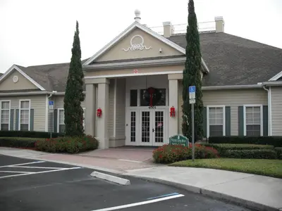 a white house with trees in front of it at Venetian Bay Villa 4 Bedroom Townhouse - Near Disney in Kissimmee