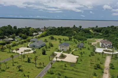 an aerial view of a house on the shore of the water at 6 Bed, 4 Bath perfect for group or large family in Oviedo
