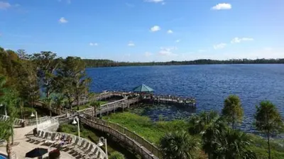 a dock on a large lake with a pier at Penthouse Close to Disney area and Malls water view in Orlando
