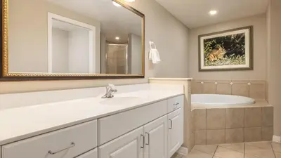 a bathroom with a sink and a tub at Holiday Inn Club Vacations At Orange Lake Resort in Orlando