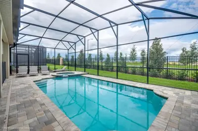 an indoor swimming pool with a glass roof at Sunshine Ridge Loop Villa #258891 Villa in Orlando