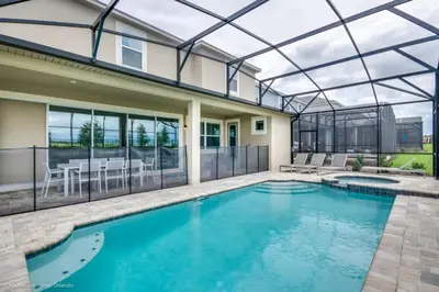 a swimming pool in a house with a glass ceiling at Sunshine Ridge Loop Villa #258891 Villa in Orlando