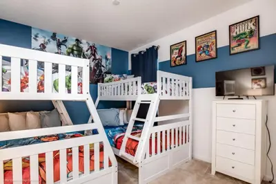 two white bunk beds in a room with blue walls at Calistoga Avenue Villa #259830 Villa in Kissimmee