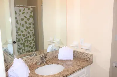 a bathroom with a sink and a mirror at Lindfields Reserve #267170 Villa in Kissimmee