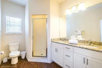 a bathroom with a toilet and a sink and a shower at Lucaya Village Resort Townhome Unit 14 Townhouse in Orlando