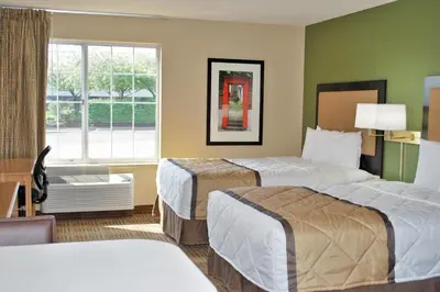 a hotel room with two beds and a window at Extended Stay America Suites - Orlando - Altamonte Springs in Orlando