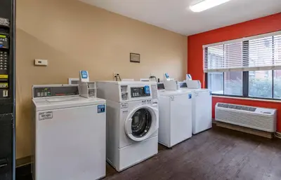 a laundry room with a washer and dryer at Extended Stay America Suites - Orlando - Maitland - 1776 Pembrook Dr in Orlando