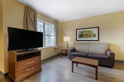 a living room with a flat screen tv and a couch at Extended Stay America Suites - Orlando - Convention Center - 6443 Westwood in Orlando