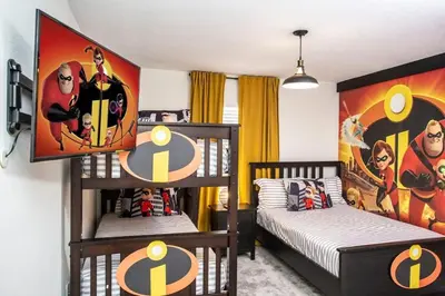 two bunk beds in a room with a superhero mural at Luxurious 4Bd Home w/ Pool 4983 in Kissimmee