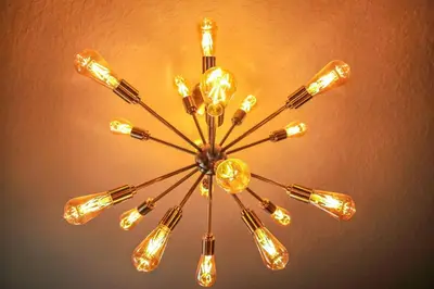 a chandelier with many lights hanging from a ceiling at G - New 5 Bedroom Home - 5 Miles to Disney - Free Water Park - Private Pool in Kissimmee