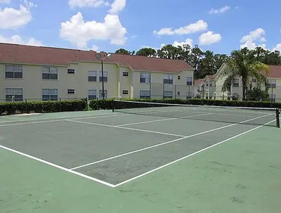 a tennis court in front of a building at Great Lovely Family Apartment close Disney in Kissimmee