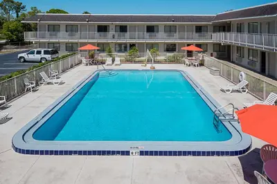 a swimming pool in front of a hotel at Rodeway Inn Kissimmee - Orlando Maingate West - Free Theme Park Shuttle in Orlando