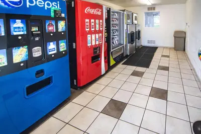 a gas station with two vending machines in a room at Motel 6-Kissimmee, FL - Orlando in Orlando