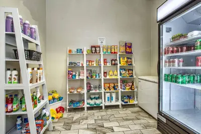 a room with shelves filled with toys in a store at Shooting Star - Family friendly 4 bed pool home on Emerald Island Resort - close to Disney World! in Kissimmee