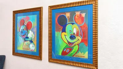 two framed paintings of mickey mouse on a wall at Mickey's Ranch - 4 bed pool home - Windsor Hills in Orlando