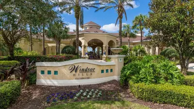 a house with a sign in front of it at Mickey's Ranch - 4 bed pool home - Windsor Hills in Orlando