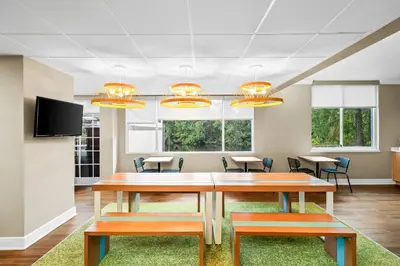 a conference room with a table and chairs at Spark by Hilton Orlando near Universal in Orlando