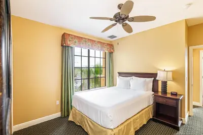 a bedroom with a bed and a window at The Berkley, Orlando in Orlando