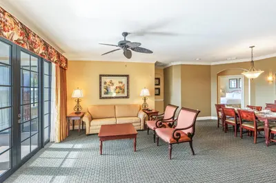 a living room with a couch and a table at The Berkley, Orlando in Orlando
