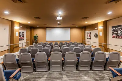 a lecture room with chairs and a screen at The Berkley, Orlando in Orlando