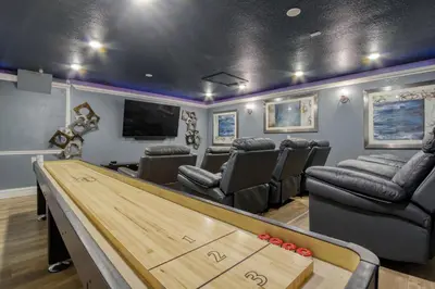 a game room with a pool table and chairs at Disney Daze Villa - 5 bed Windsor Hills pool home in Orlando
