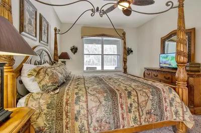 a bedroom with a bed and a window at Mickeys Sunspot - 6 bed Emerald Island Resort pool home in Kissimmee