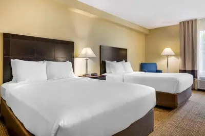 two beds in a hotel room with two beds at I-Drive Hotel at Universal in Orlando