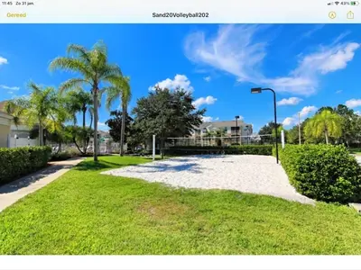 a park with palm trees and a street light at Mickey Holiday Home a Windsor Palms Villa in Kissimmee
