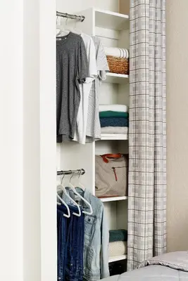 a closet filled with lots of clothes at InTown Suites Extended Stay Select Orlando FL - UCF in Orlando