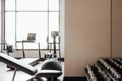 a room with a gym with chairs in it at ette luxury hotel & spa - Near Disney Theme Parks in Orlando