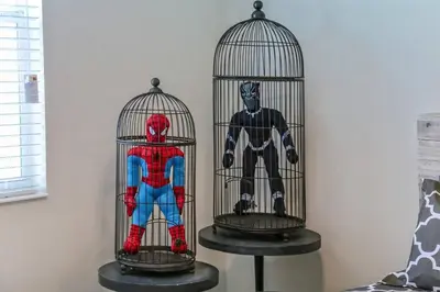 two bird cages with a spider man in them at H - New 2 Bedroom Condo - 5 Miles to Disney - Free Water Park in Kissimmee
