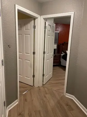 an empty room with two doors and a hallway at Windsor Hills Resort 5BR Villa, Amenities, Private Pool & Water Park, Near Disney, Sea World, Universal in Orlando